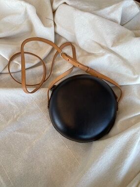 Minimalist Black Round Crossbody with Tan Strap